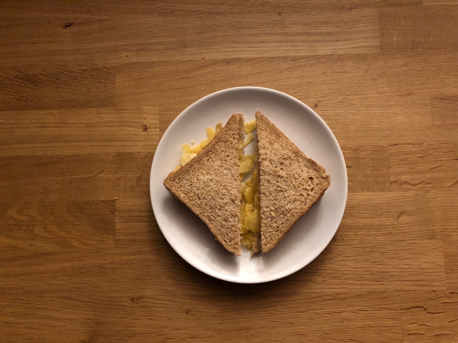 Overhead view of diagonally-cut brown sandwich
