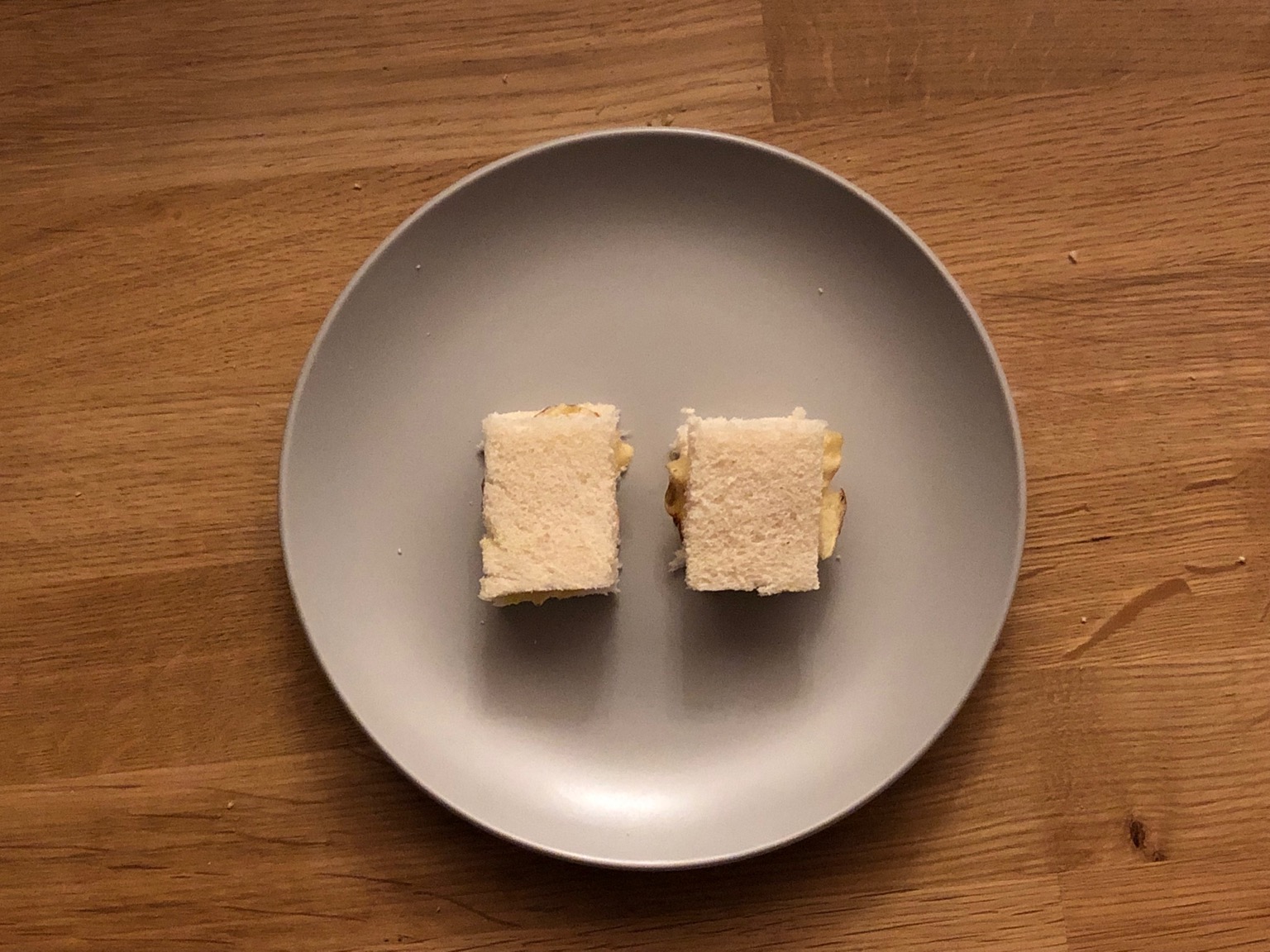 Overhead view of tiny white crisp sandwiches