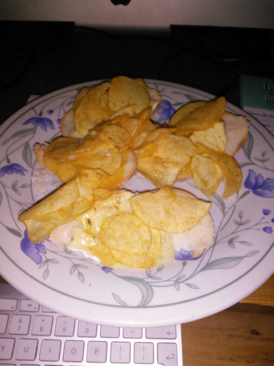 Flash photo of crisps and cheese on white bread