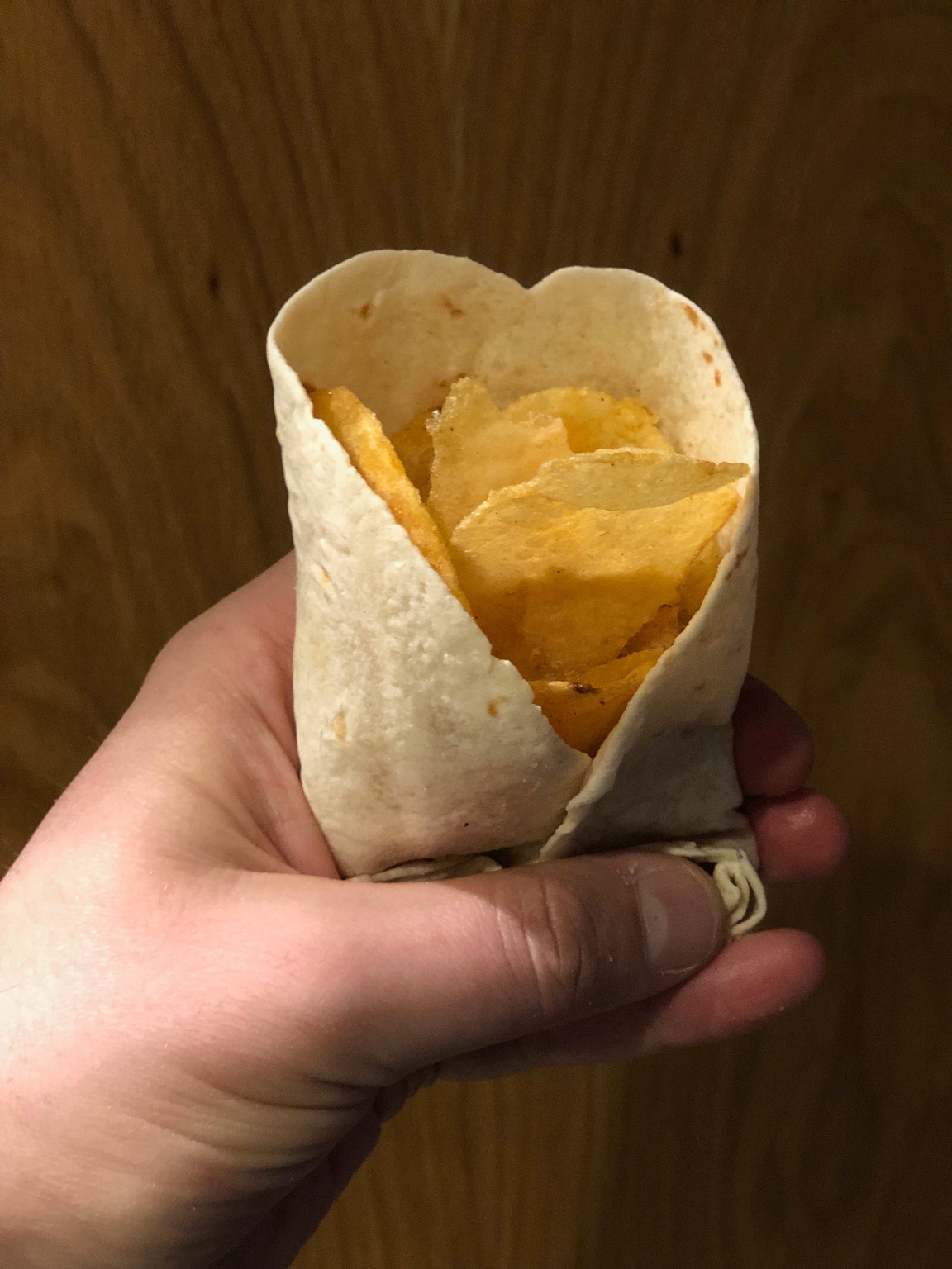 Potato crisps held in a tortilla wrap