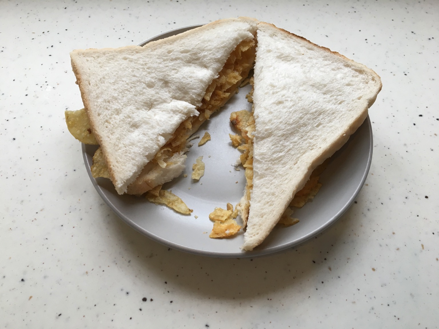 Diagonally-sliced white crisp sandwich