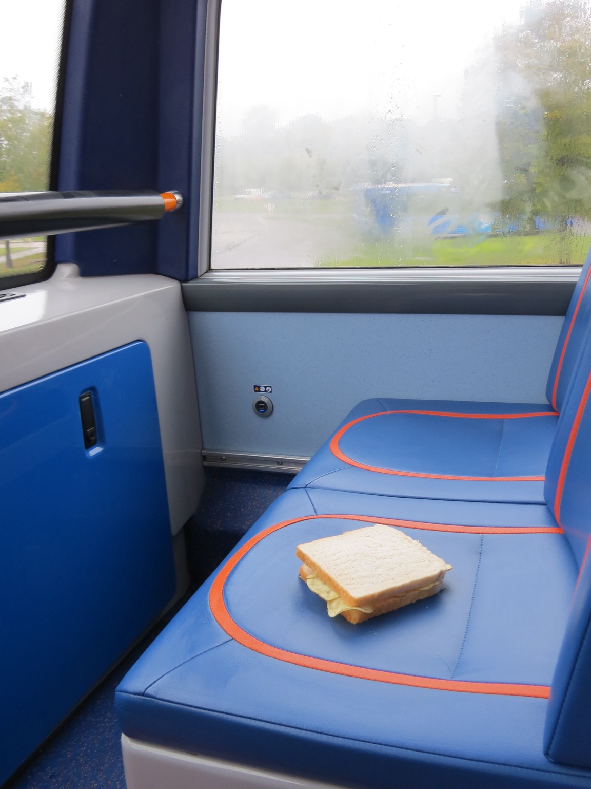 Bus seat with a potato crisp sandwich placed on it