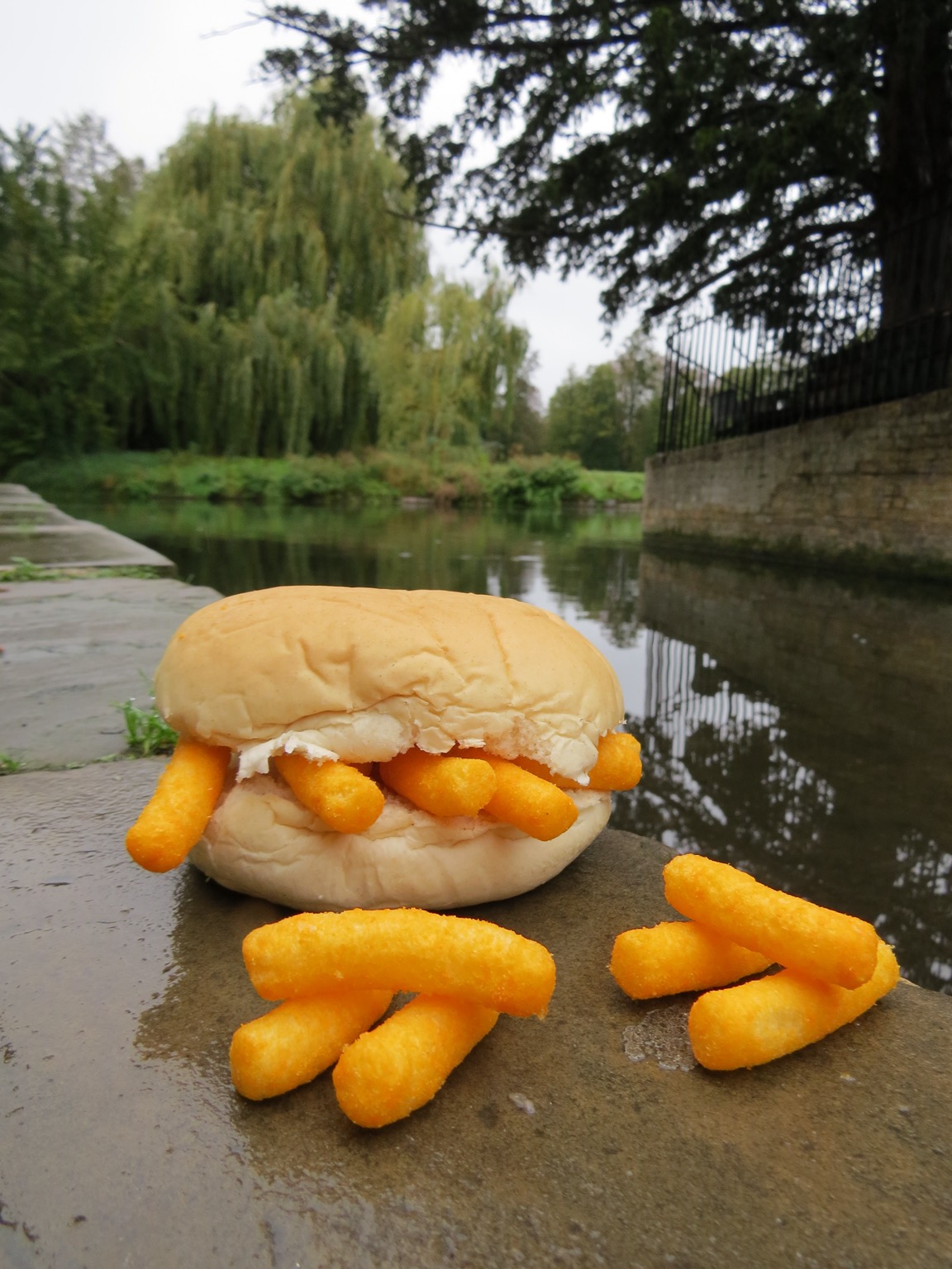 Roll containing and alongside Wotsits placed by water