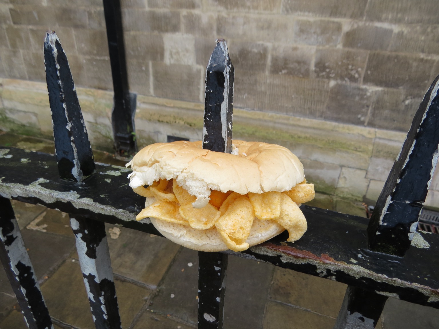 White Quavers-filled roll impaled on railings