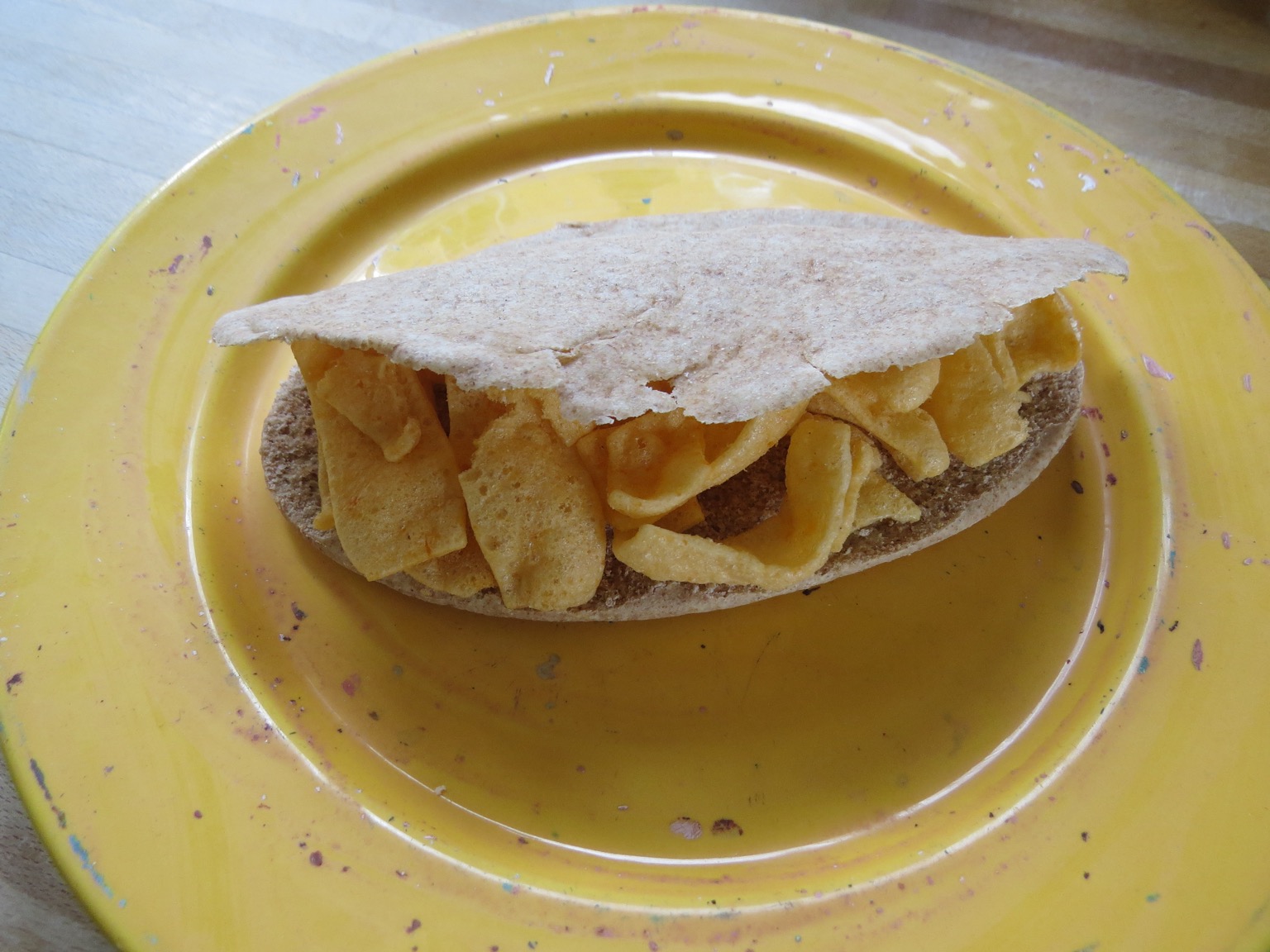 Quavers in a pitta bread on a plate