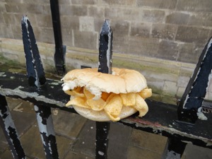 White Quavers-filled roll impaled on railings