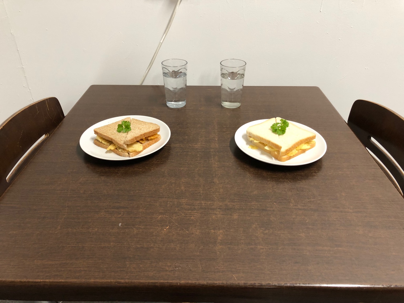Brown and white crisp sandwiches on dining table