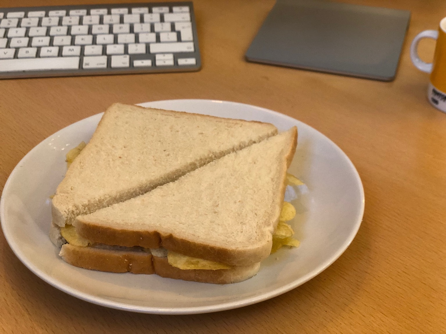 White diagonally-cut crisp sandwich on a desk