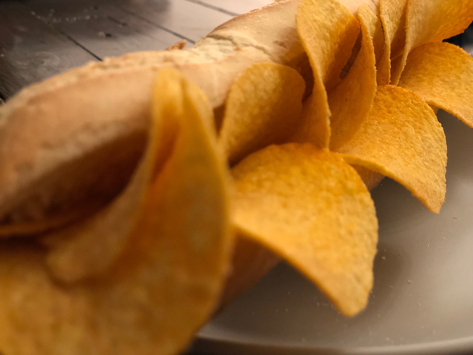 Close-up of Pringles poking out of a baguette