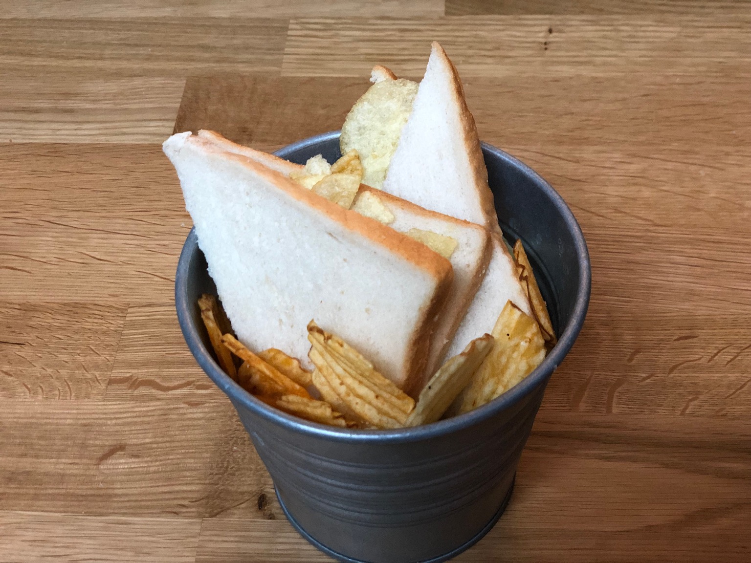 Crisp sandwich and loose crisps in metal bucket