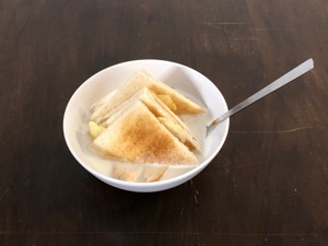 Potato crisps within crustless toast with milk