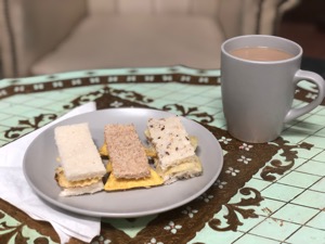 Mini sandwiches with assorted snacks and breads