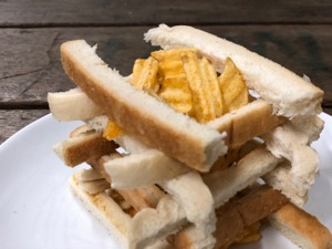 Close-up of lattice of crusts and crinkle-cut crisps