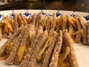 Small diagonally-cut brown crisp sandwiches