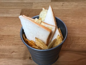 Crisp sandwich and loose crisps in metal bucket