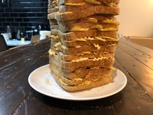 Lower half of brown loaf filled with crinkle-cut crisps