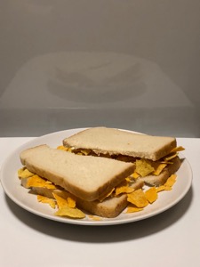 White sliced bread containing Doritos