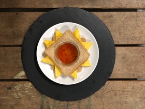 Overhead view of Doritos sandwich and dip jar