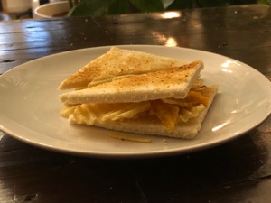 Crinkle-cut crisps between toasted white bread