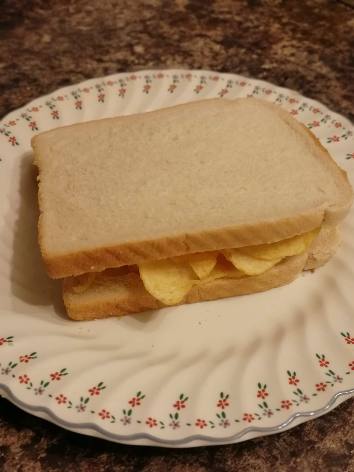 White bread potato crisp sandwich on a plate