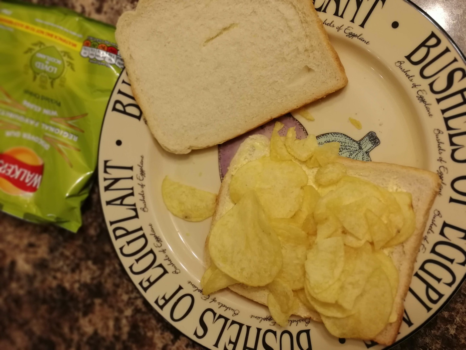 White crisp sandwich with lid off and bag alongside