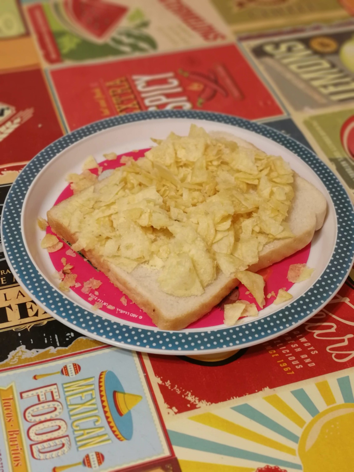 Open white crisp sandwich on a plate