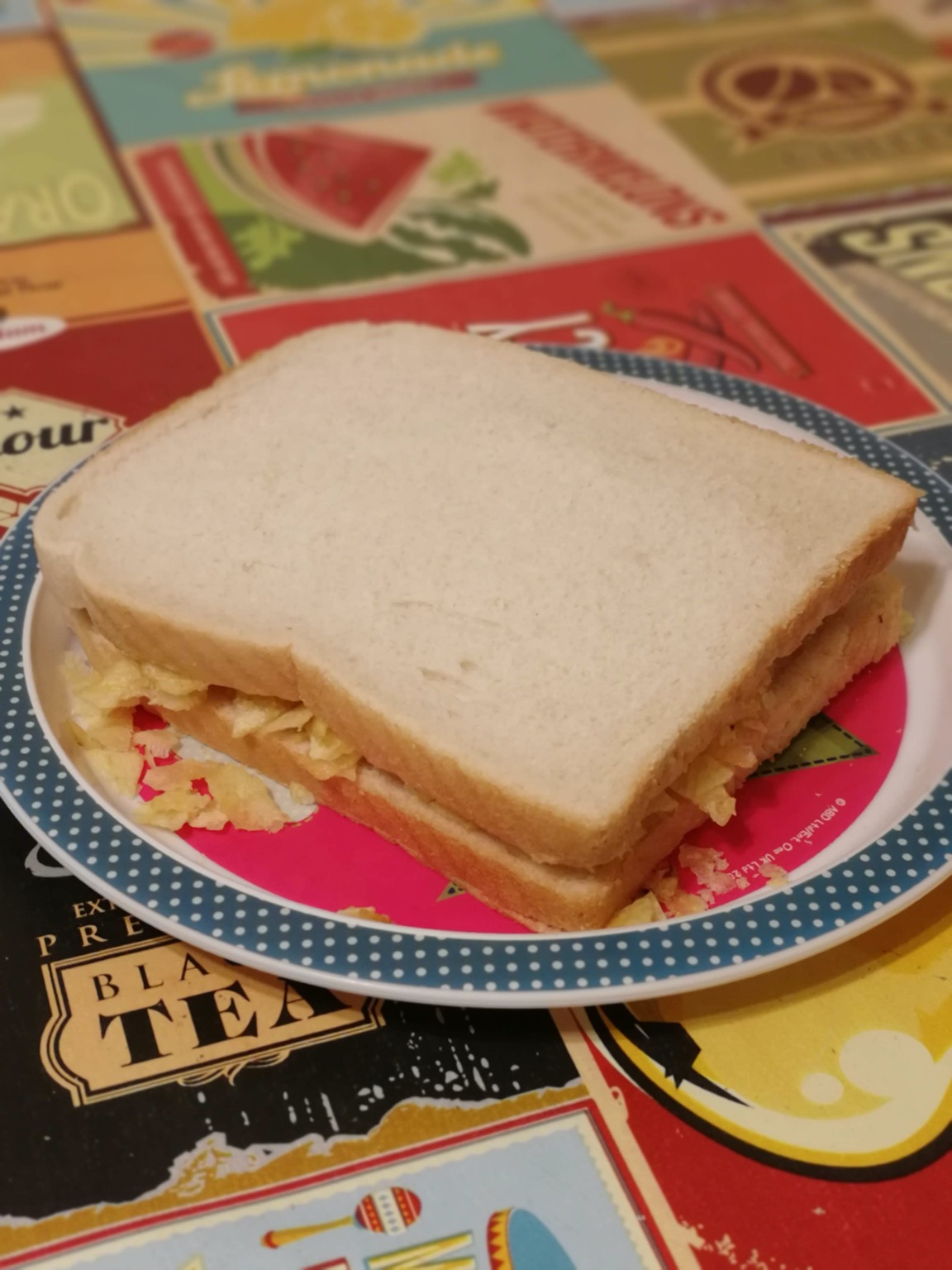 White potato crisp sandwich on a plate on a tablecloth