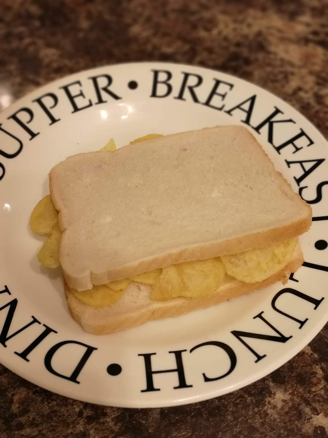 White crisp sandwich on a typographic plate
