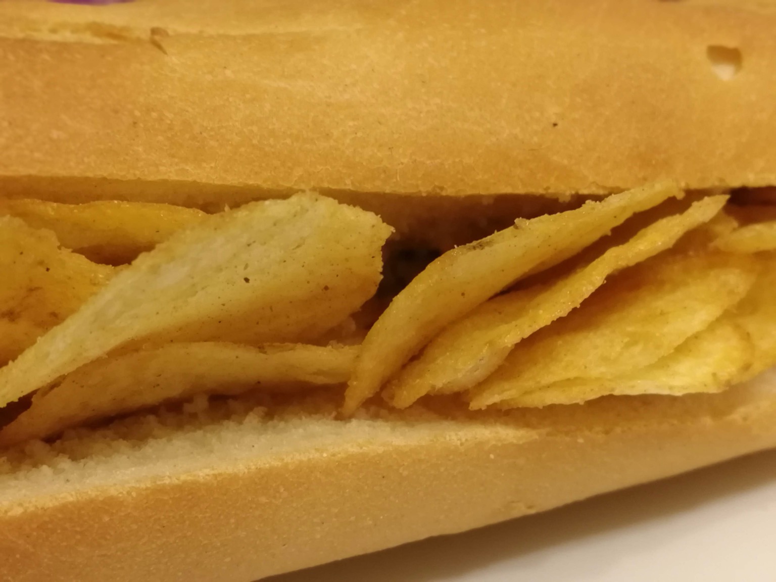 Extreme close up of crisp-filled baguette