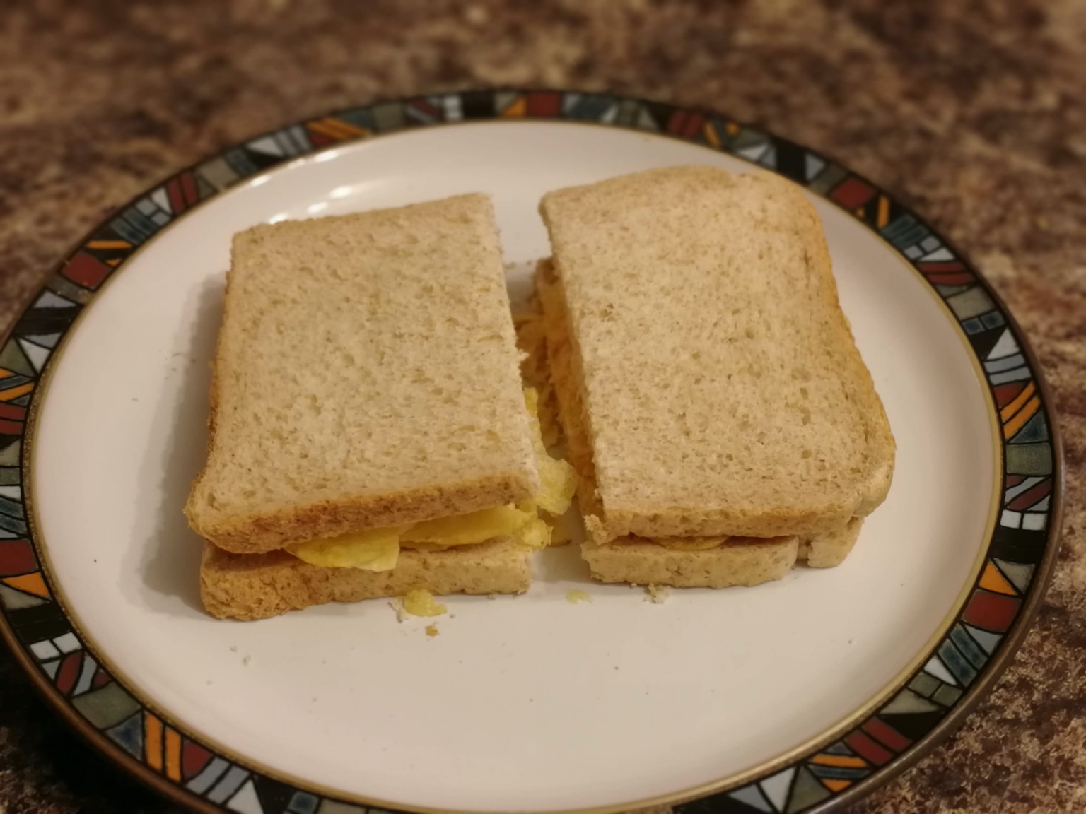 Halved crisp-filled brown bread sandwich