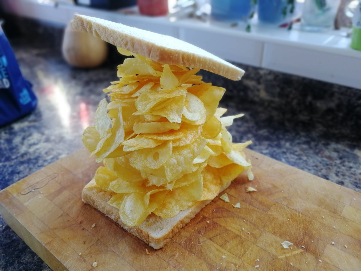 Massively overfilled crisp sandwich with precarious lid