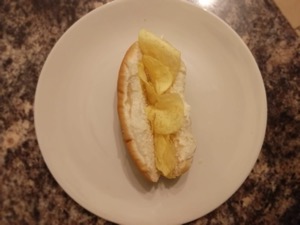 Finger roll filled with potato crisps viewed from above