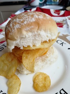 Close up of crisp-filled white roll, festive setting