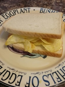 White potato crisp sandwich on a decorative plate