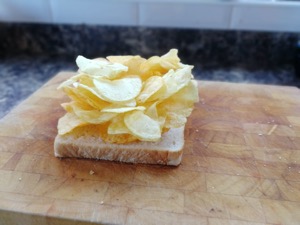 Crisps piled onto white bread