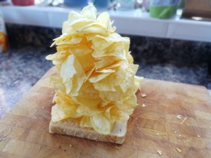 Loooads of crisps piled onto white bread