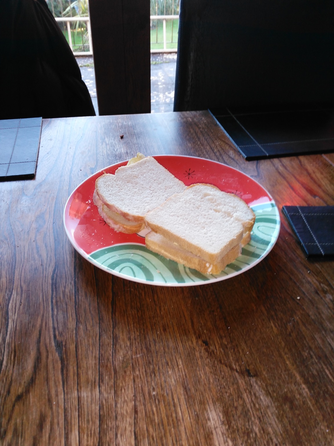 Two crisp sandwiches with white sliced bread