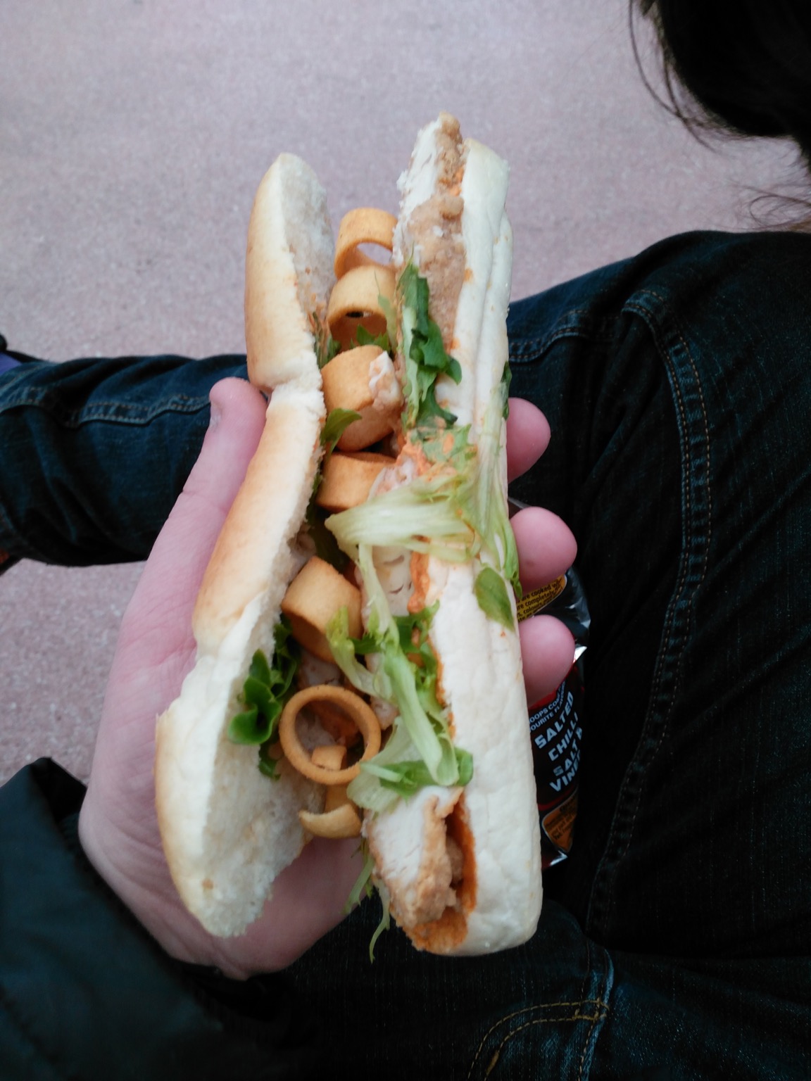 Baguette containing Hula Hoops, meat and salad