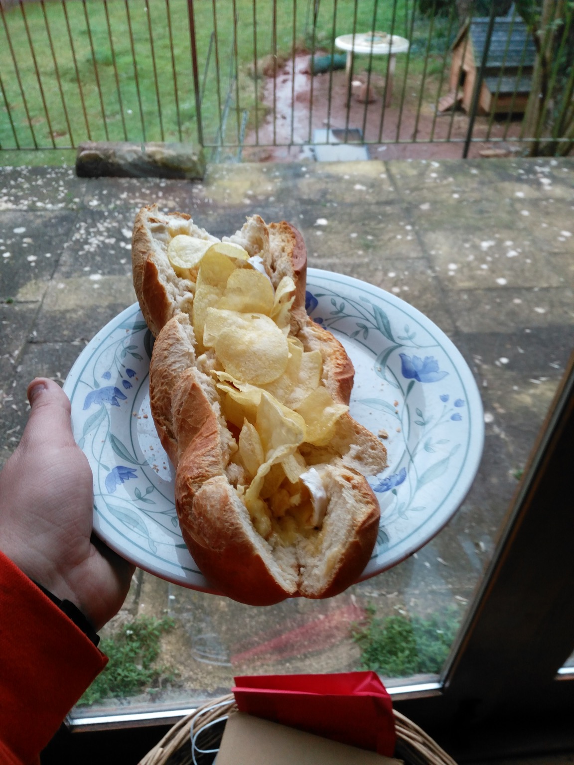 Potato crisps and cheese in a baguette