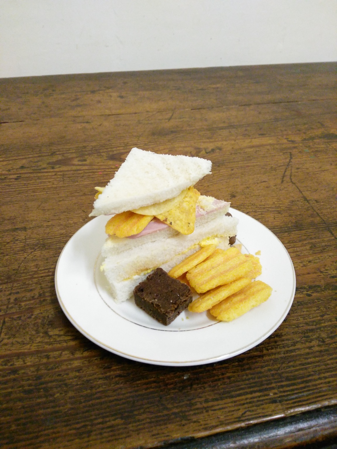 Frazzles and ham in a tiny crustless sandwich