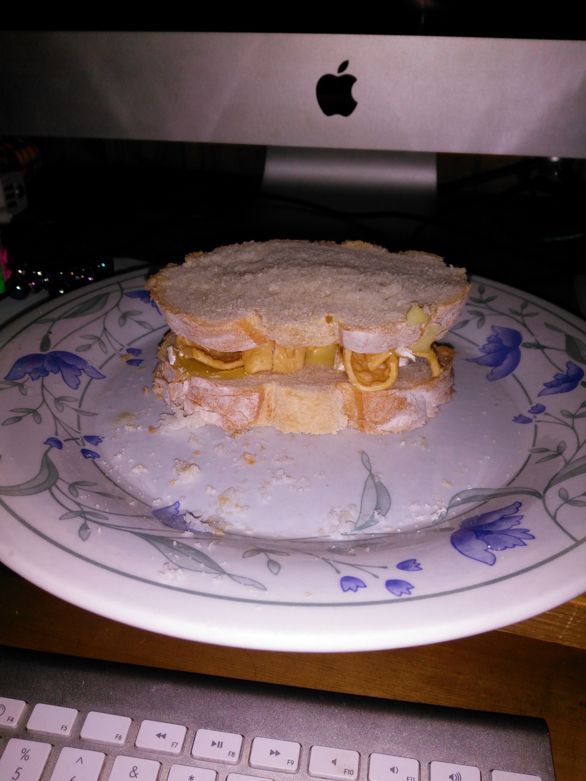 Flash photo of sandwich containing corn snacks