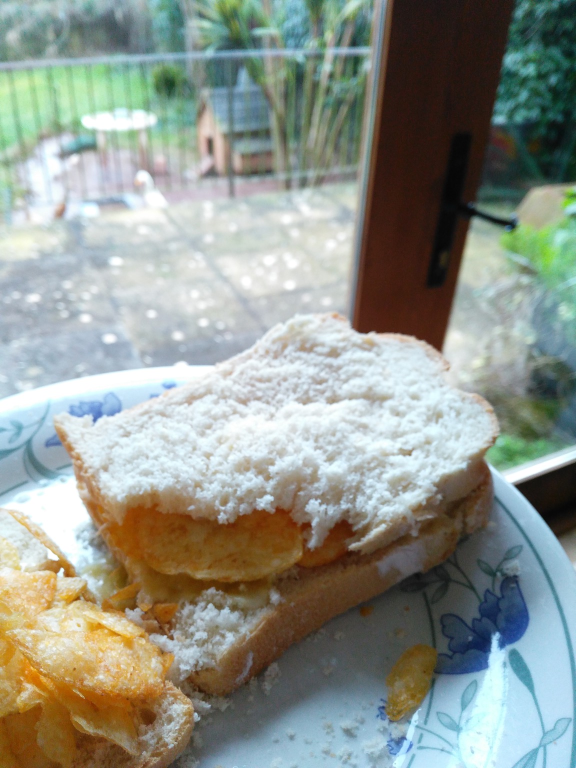 White crisp sandwich with a corner torn away