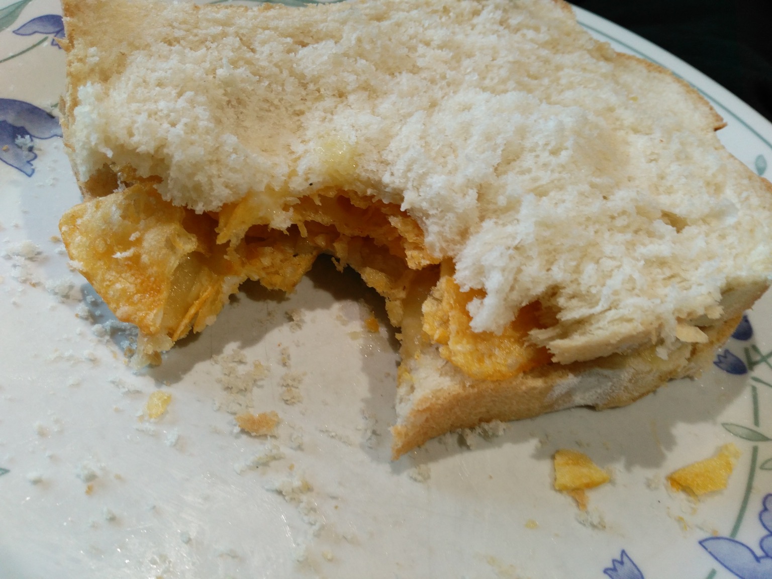 Close-up of crisp sandwich with a bite out of it
