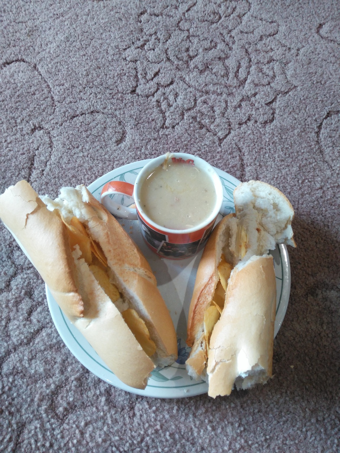 Torn crisp baguette alongside a Cup-a-Soup