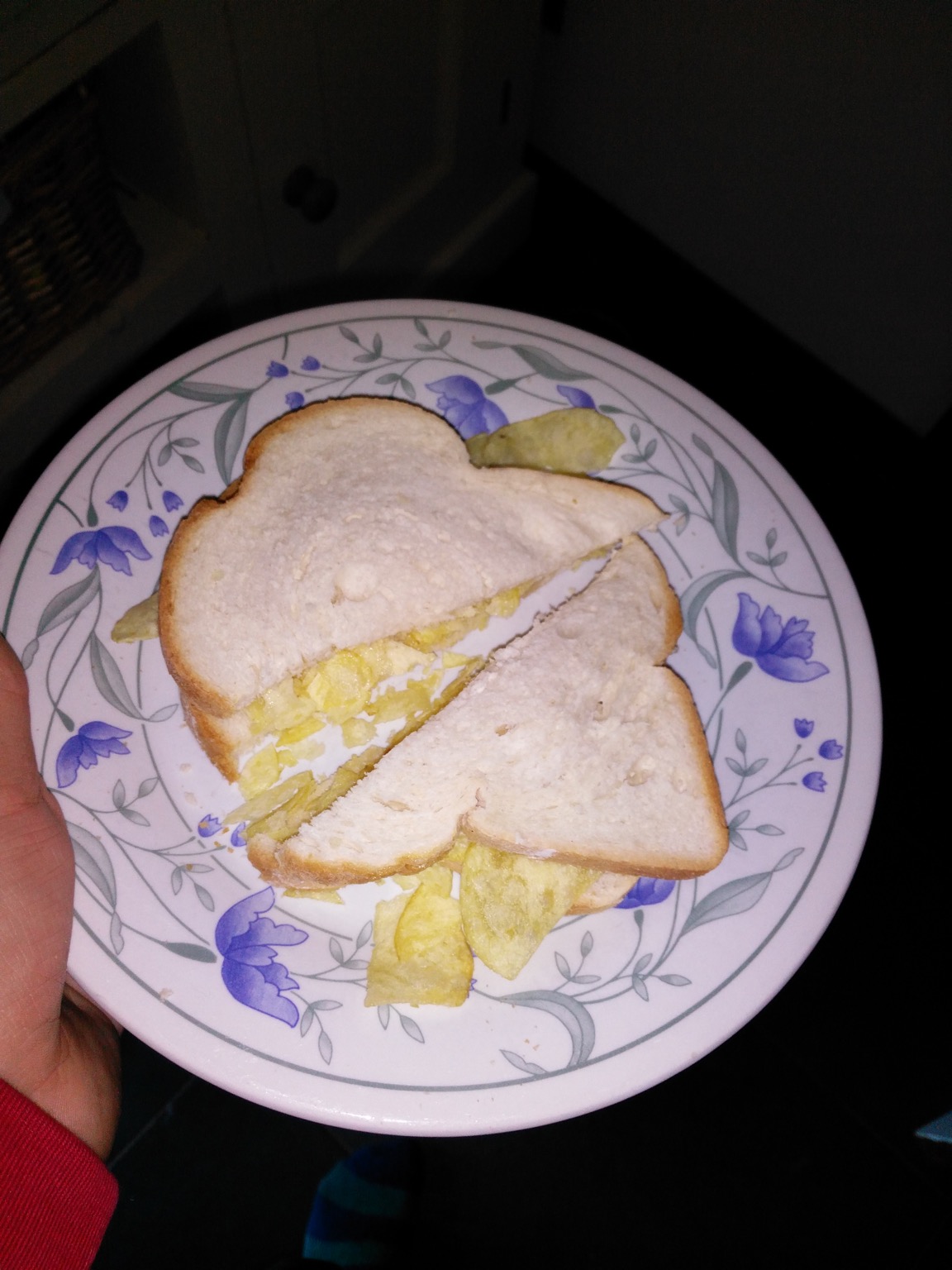 Flash photo of diagonally-cut white crisp sandwich