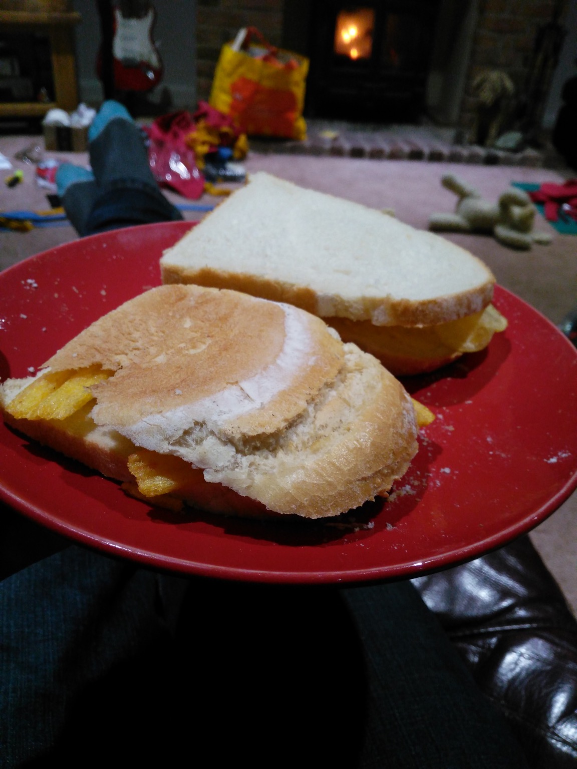 Two sandwiches containing crisps and Frazzles