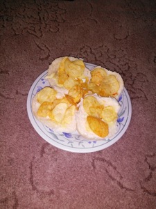 Flash photo of crisps on open bread rolls