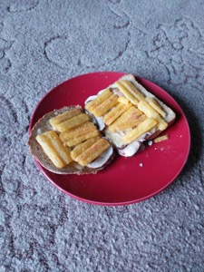 Frazzles, mushrooms and cheese on brown bread