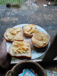 Crisps, cheese and sauce on bread and a roll