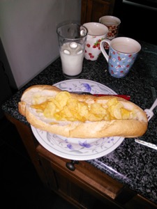 Flash photo of baguette filled with potato crisps